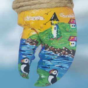 Lighthouse with Houses and Two Puffins in Cove on Golden Sunset Lobster Claw Ornament