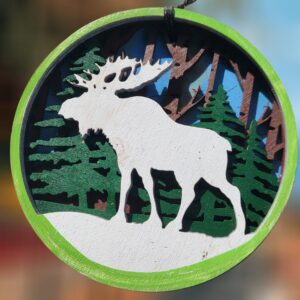 Moose Winter Scene with Trees and Blue Background Layered Wood Ornament