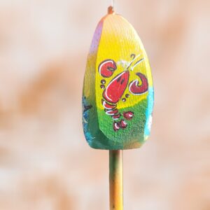 Red Lobster of 4 Sided Buoy Yellow Green Background