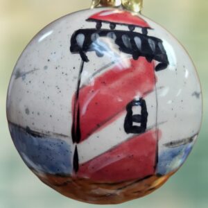Red and White Striped Lighthouse on Coastal Ocean Scene Ceramic Ball Ornament